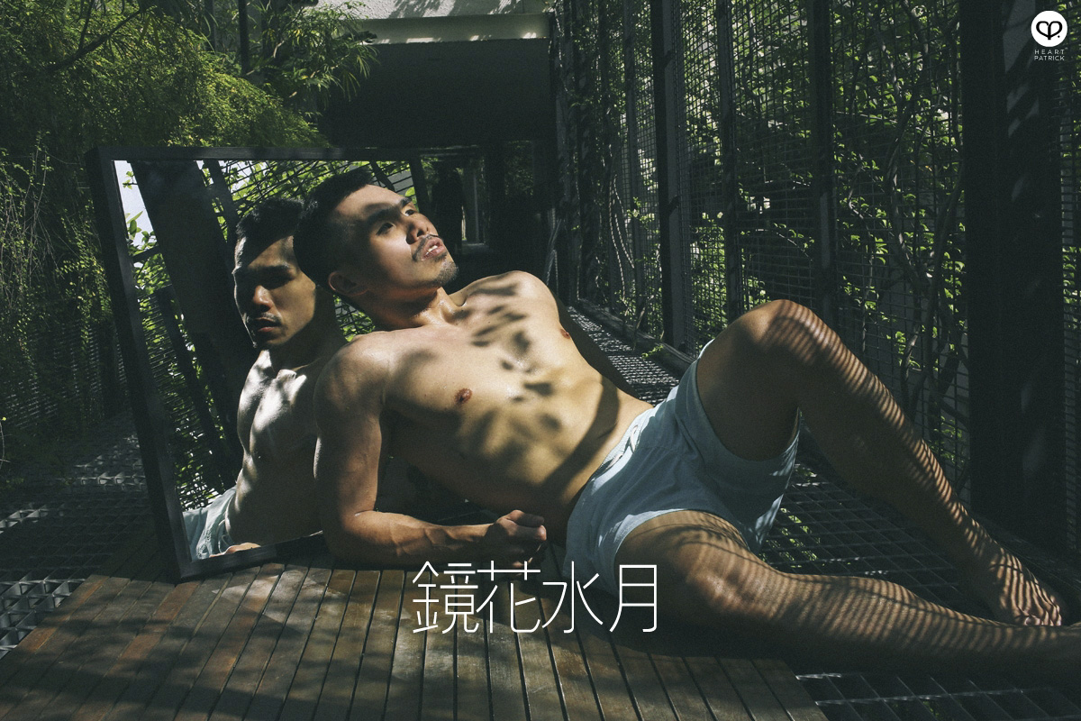 asian male creative portrait with mirror and trunks