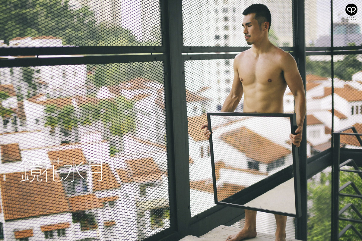 asian male creative portrait with mirror and trunks