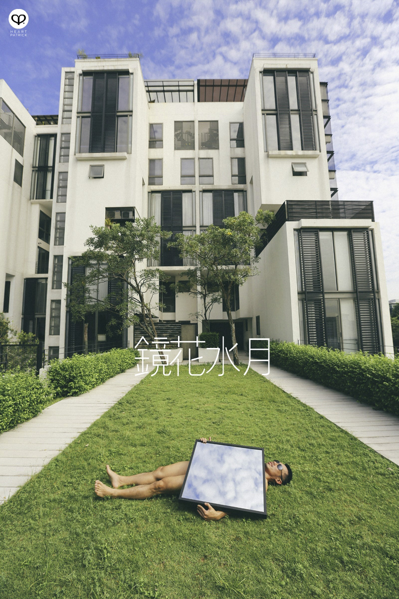 asian male creative portrait with mirror and trunks