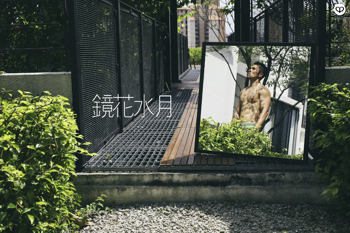 asian male creative portrait with mirror and trunks
