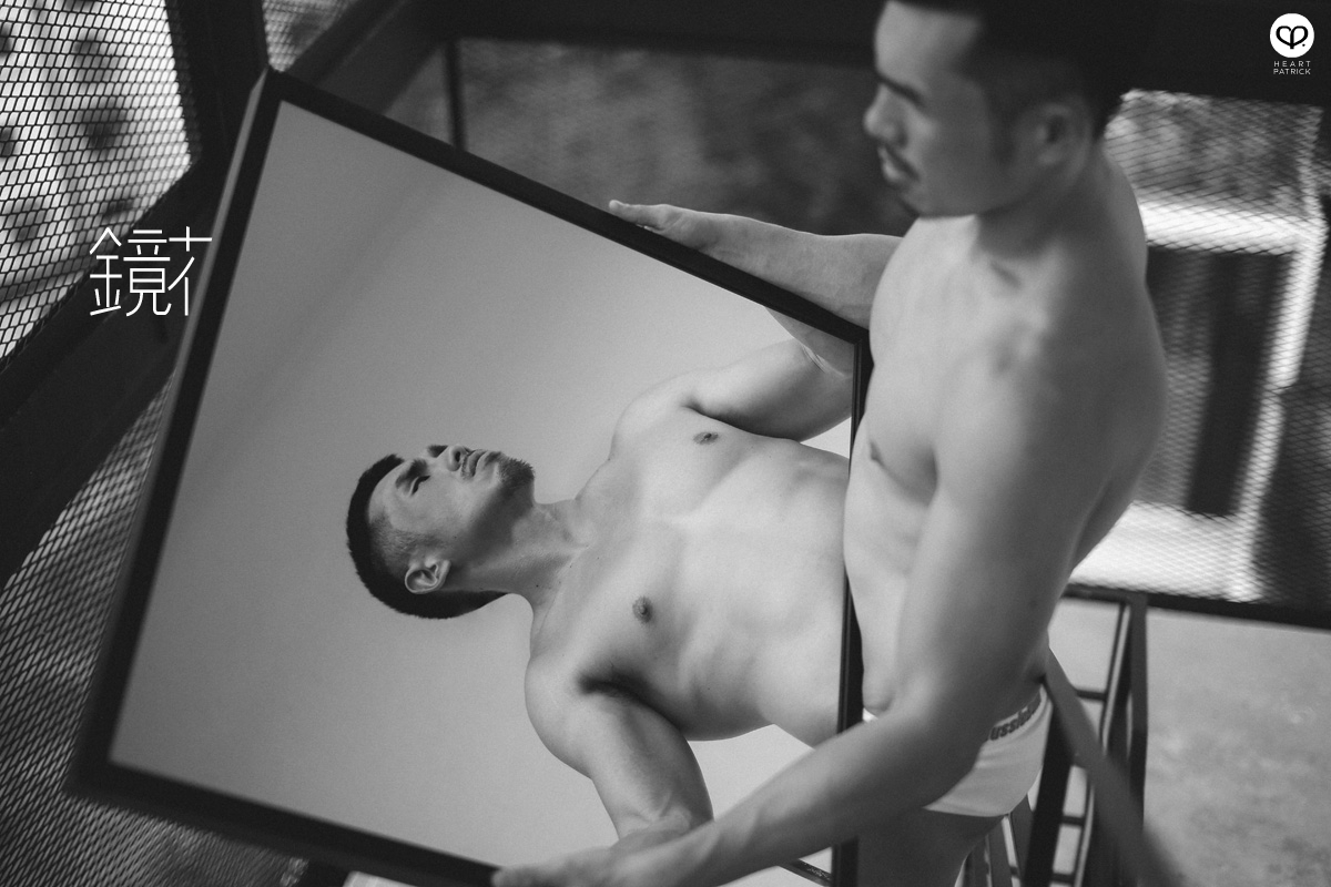 asian male creative portrait with mirror and trunks