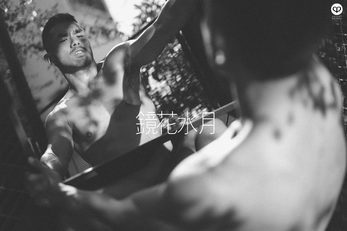 asian male creative portrait with mirror and trunks